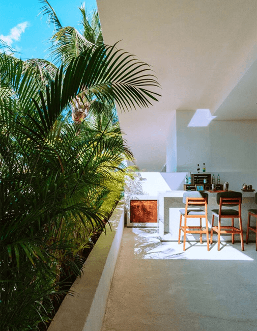 Luxury hotel interior with palm trees